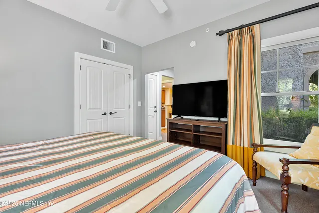 a spacious bathroom with a tub sink shower and mirror