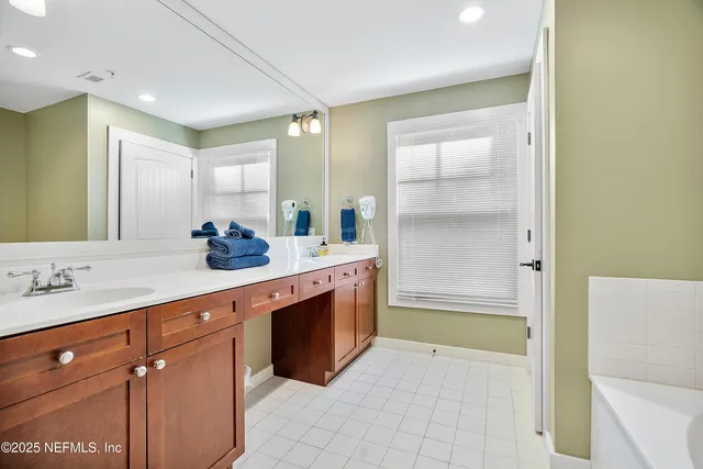 a bathroom with a tub and shower