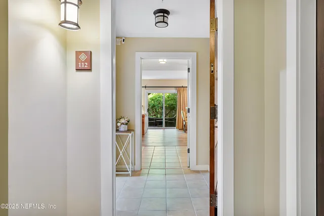 a view of a hallway view with wooden floor and staircase