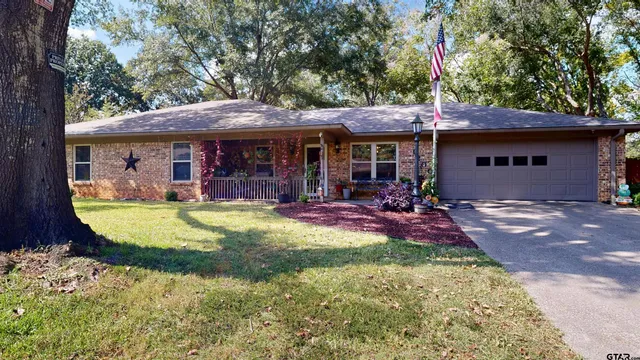 a view of a house with swimming pool and a porch