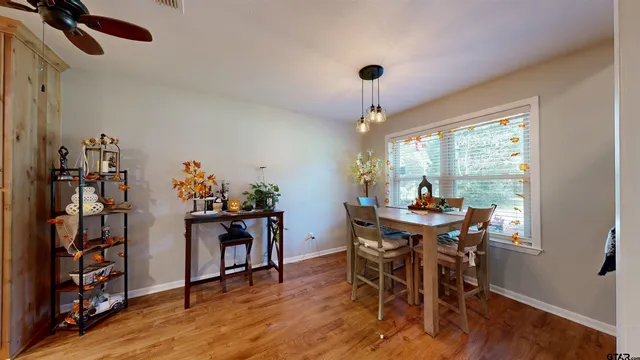 a view of a dining room with furniture window and wooden floor