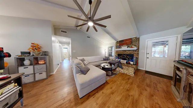 a living room with furniture and a fireplace