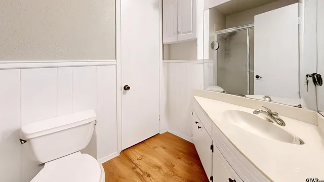 a bathroom with a sink and toilet