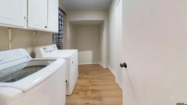 a utility room with dryer and washer