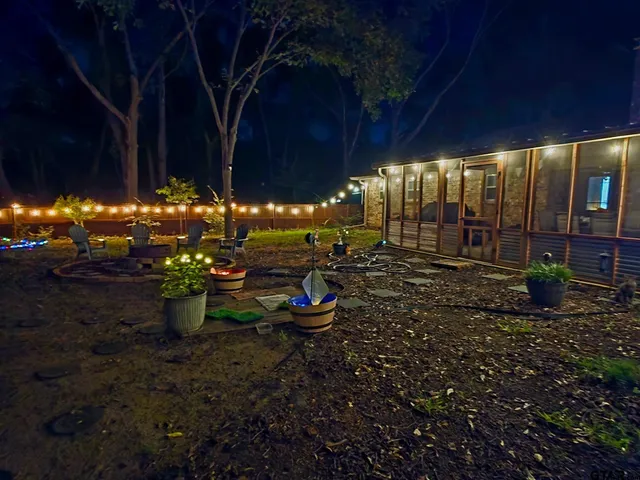 a view of a backyard with sitting area