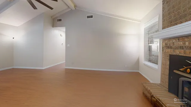 an empty room with windows