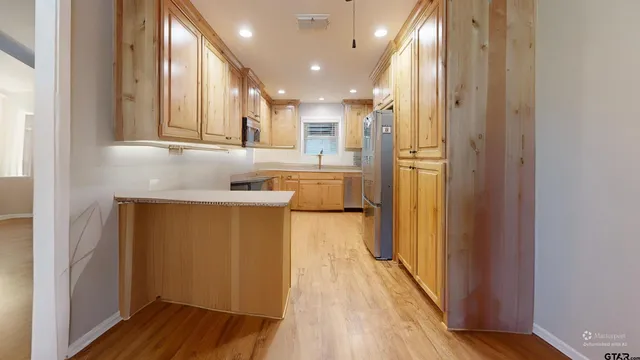 a bathroom with a sink a mirror and a shower
