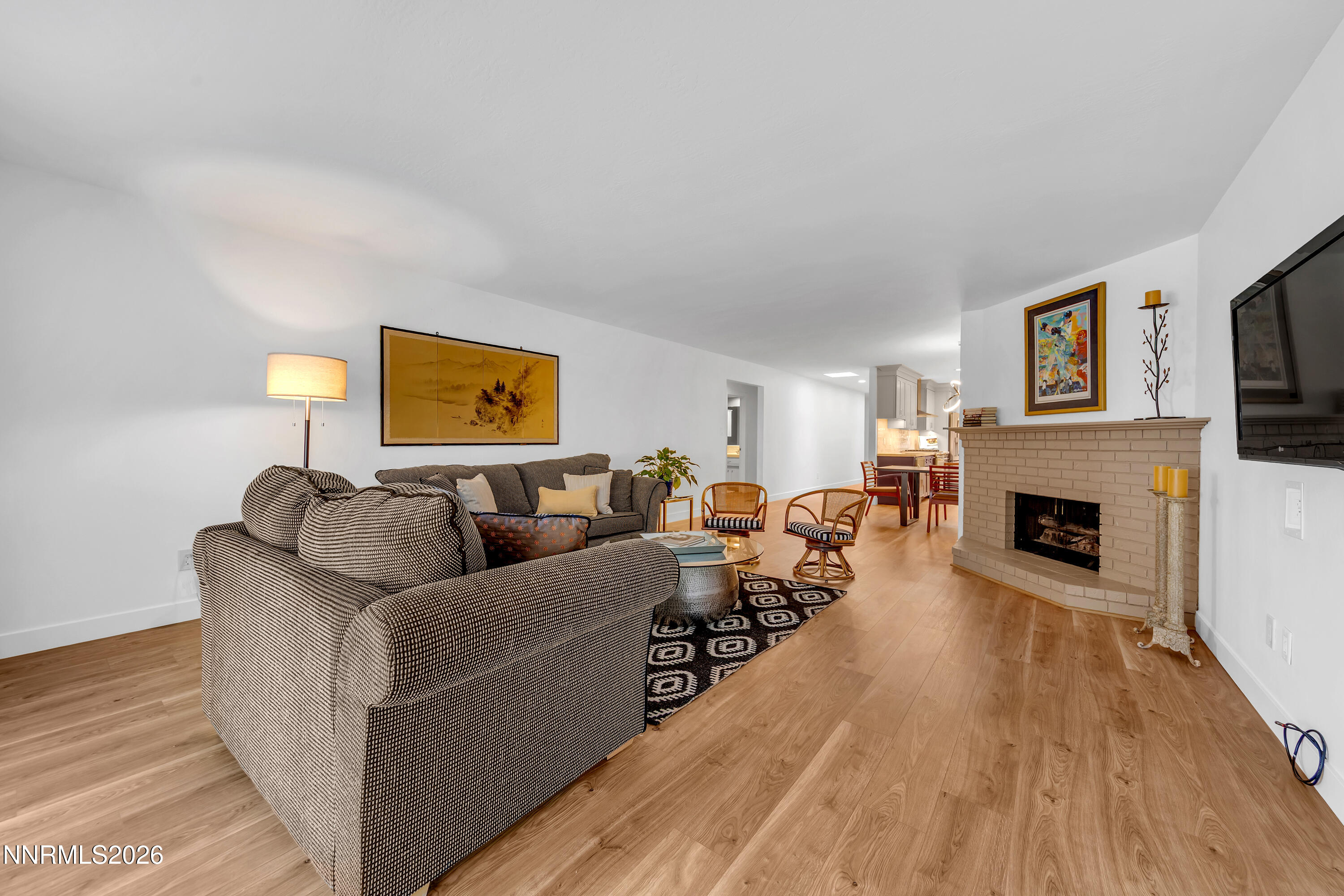 4915 Lakeridge Terrace West Reno, NV 89509 - Photo 14 of 41 a living room with furniture a fireplace and a flat screen tv
