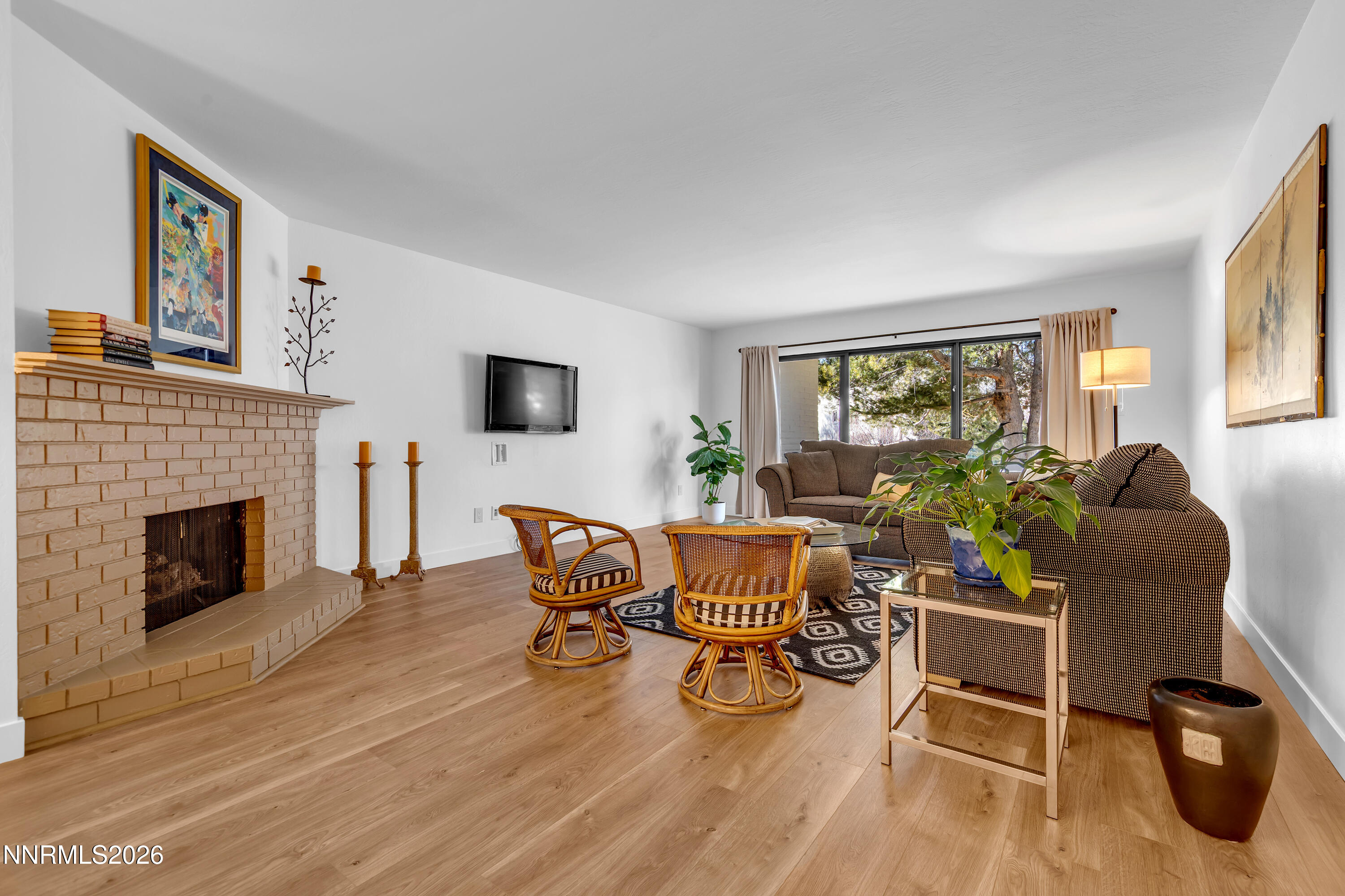 4915 Lakeridge Terrace West Reno, NV 89509 - Photo 16 of 41 a living room with furniture a fireplace and a flat screen tv
