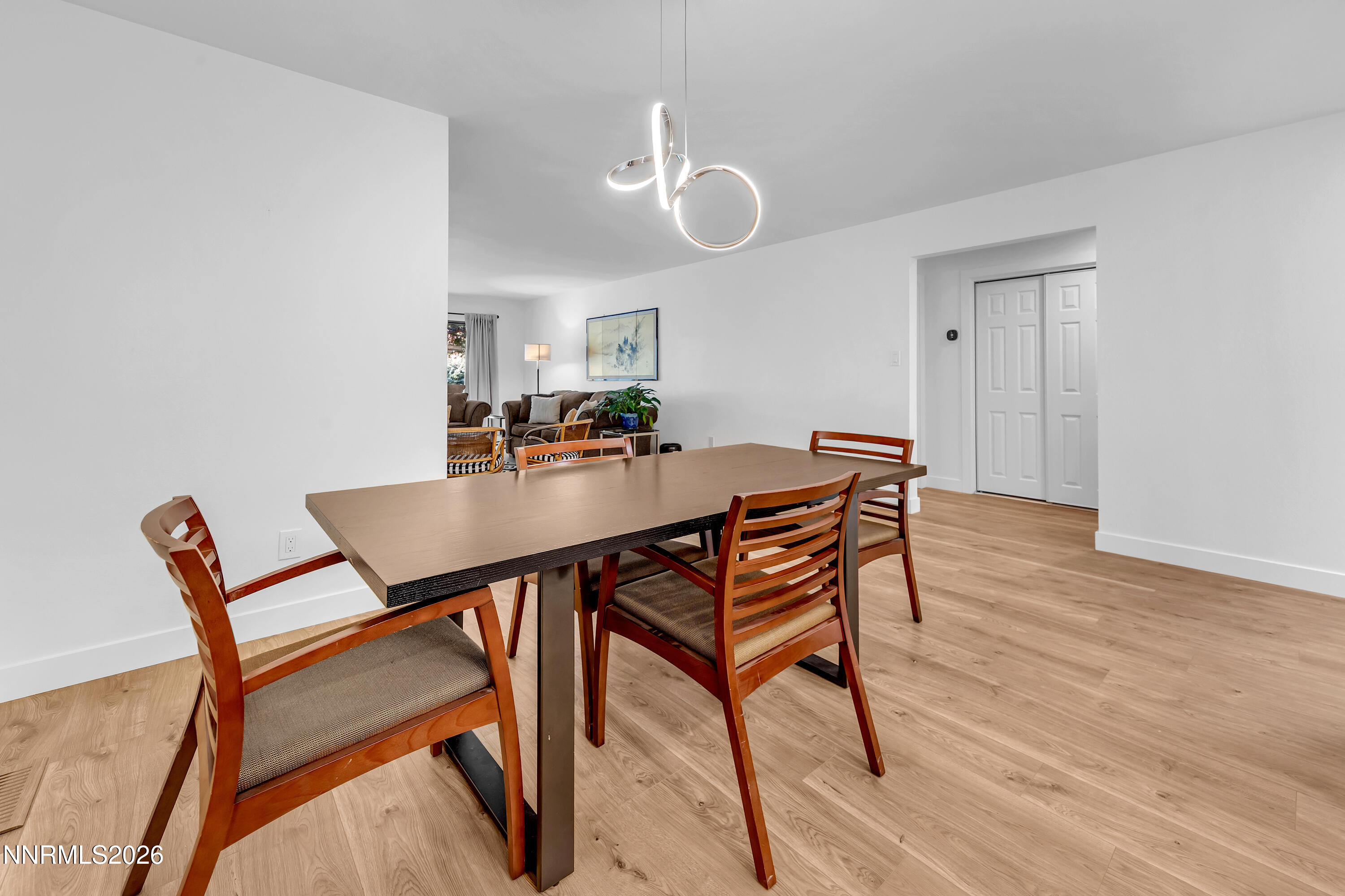 4915 Lakeridge Terrace West Reno, NV 89509 - Photo 19 of 41 a view of a dining room with furniture and wooden floor