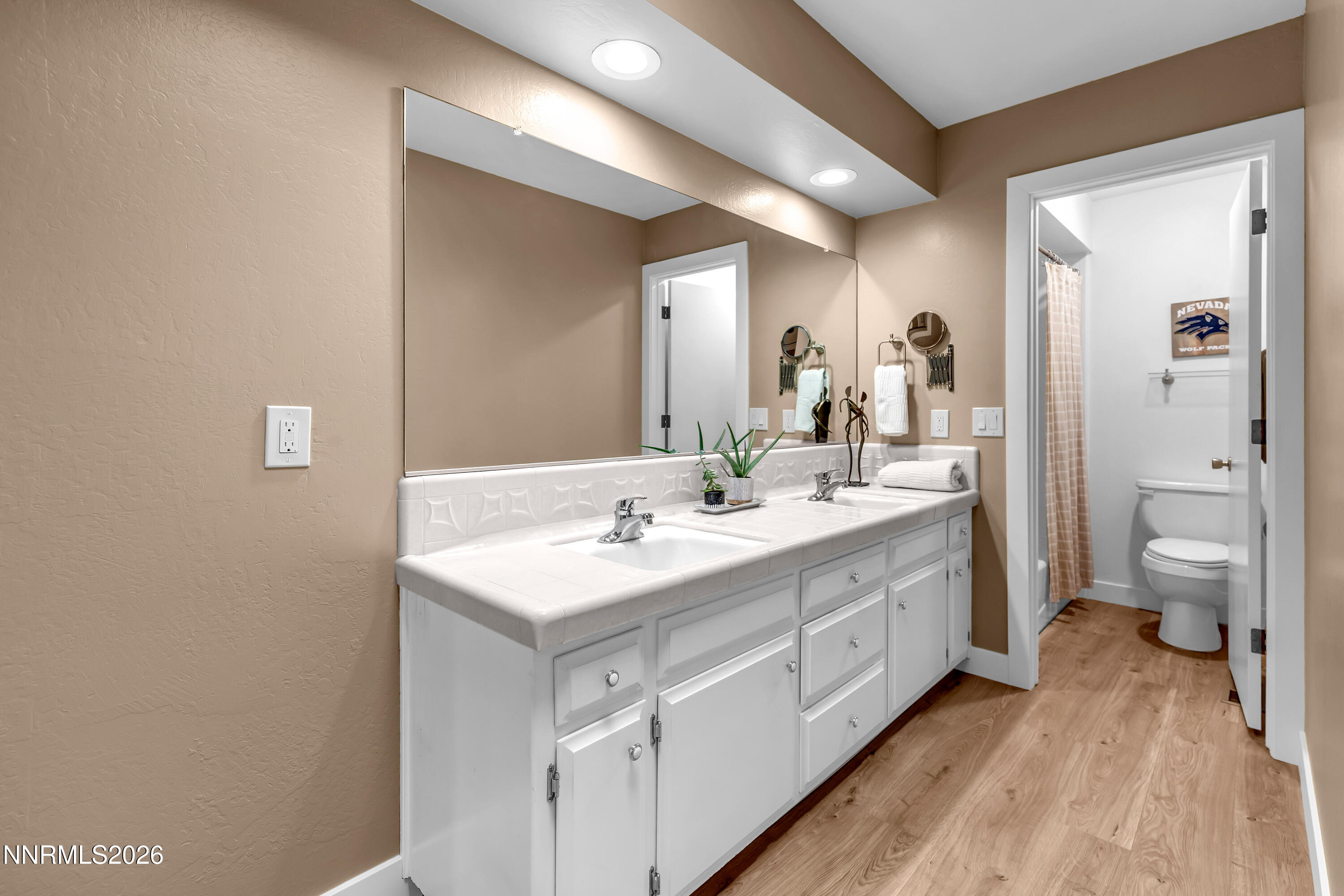 4915 Lakeridge Terrace West Reno, NV 89509 - Photo 24 of 41 a bathroom with a double vanity sink toilet and shower