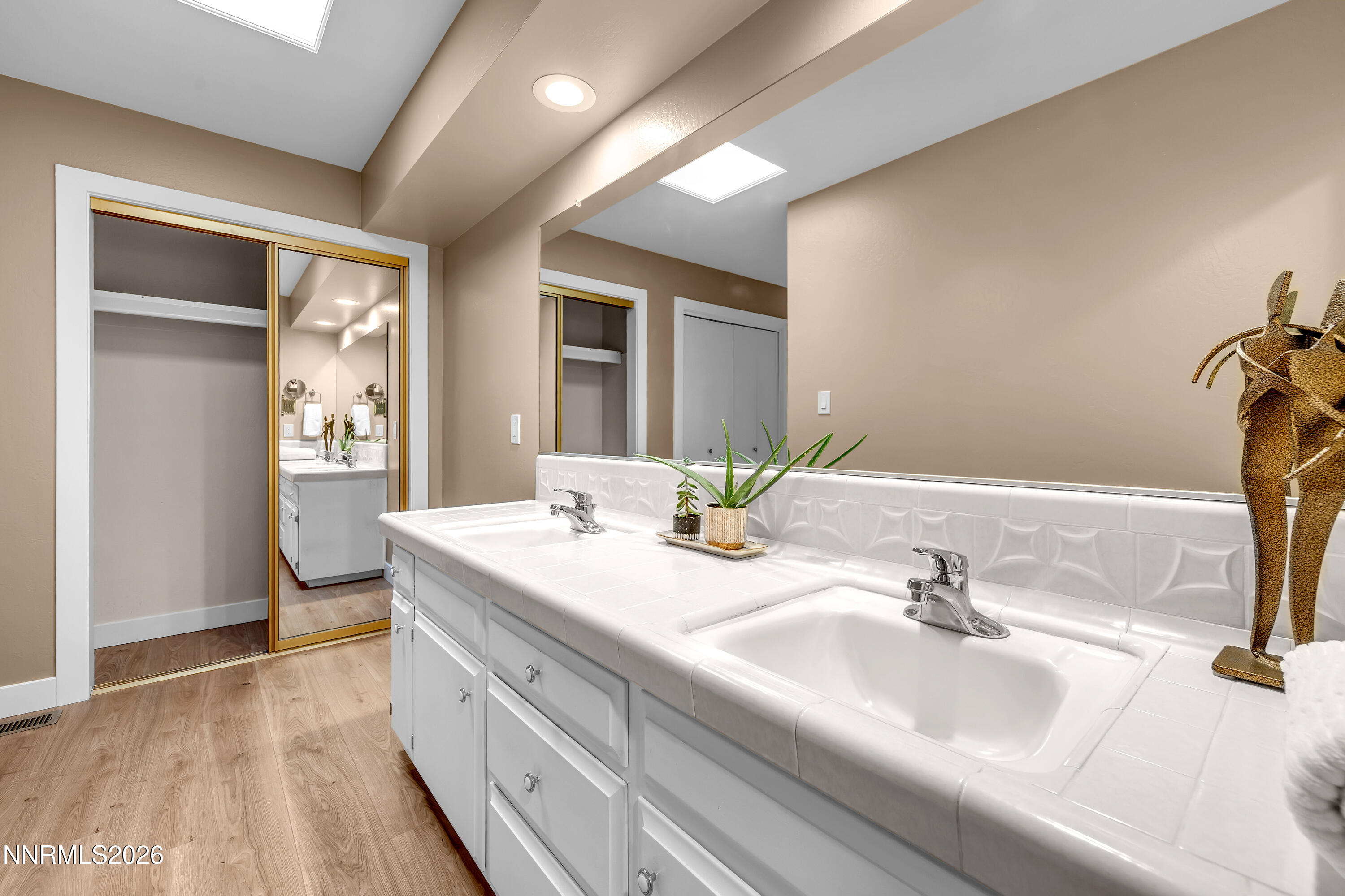 4915 Lakeridge Terrace West Reno, NV 89509 - Photo 26 of 41 a bathroom with a sink double vanity and a mirror