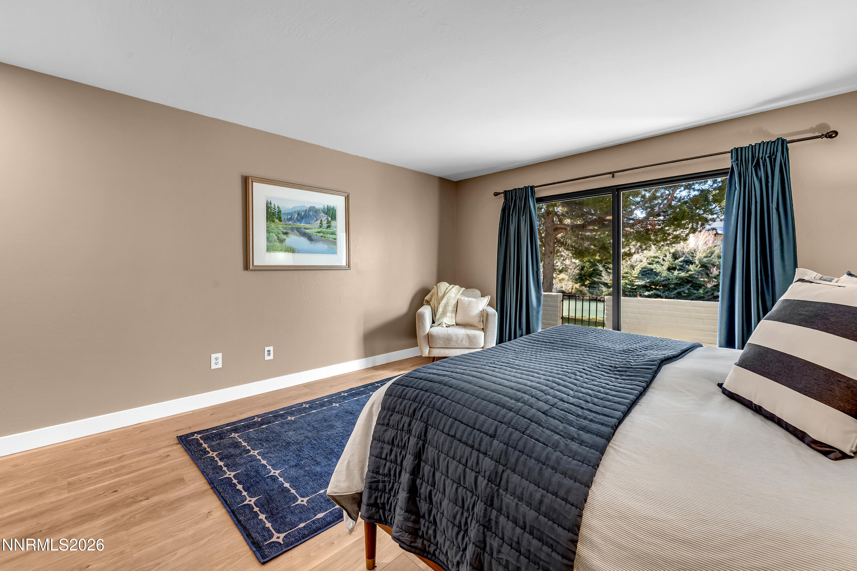 4915 Lakeridge Terrace West Reno, NV 89509 - Photo 28 of 41 a bedroom with a bed and glass door