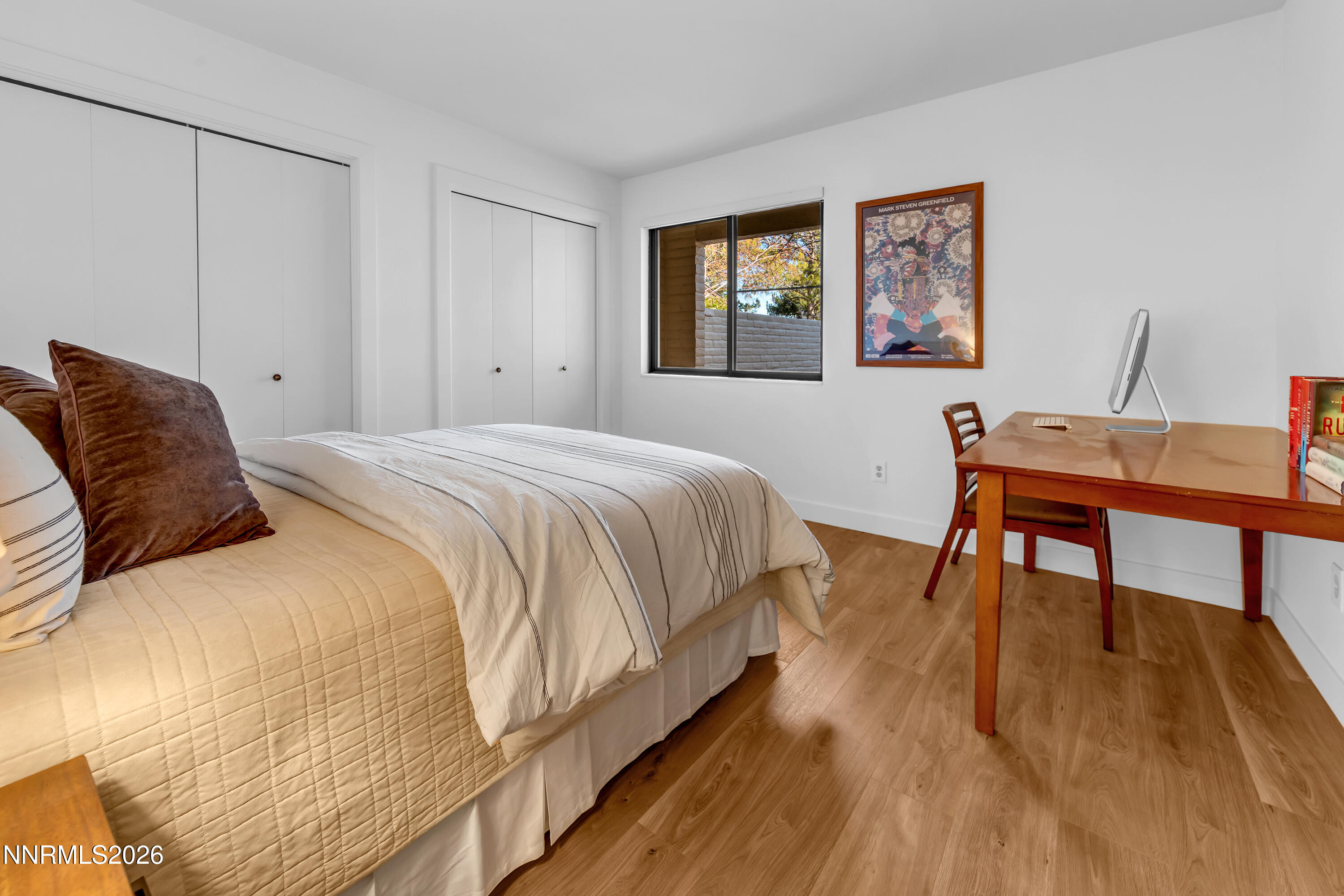 4915 Lakeridge Terrace West Reno, NV 89509 - Photo 30 of 41 a bedroom with a bed and a table in it