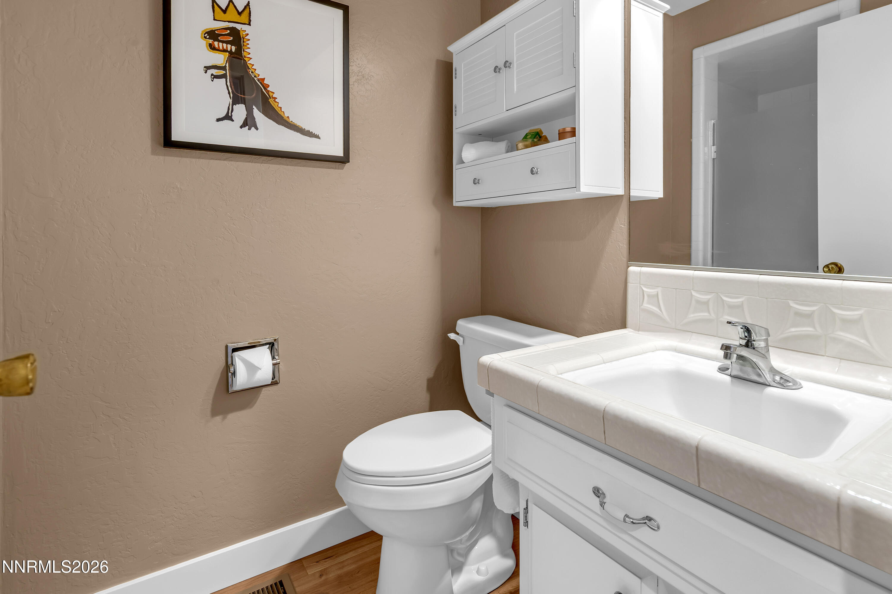 4915 Lakeridge Terrace West Reno, NV 89509 - Photo 31 of 41 a bathroom with a toilet a sink and mirror