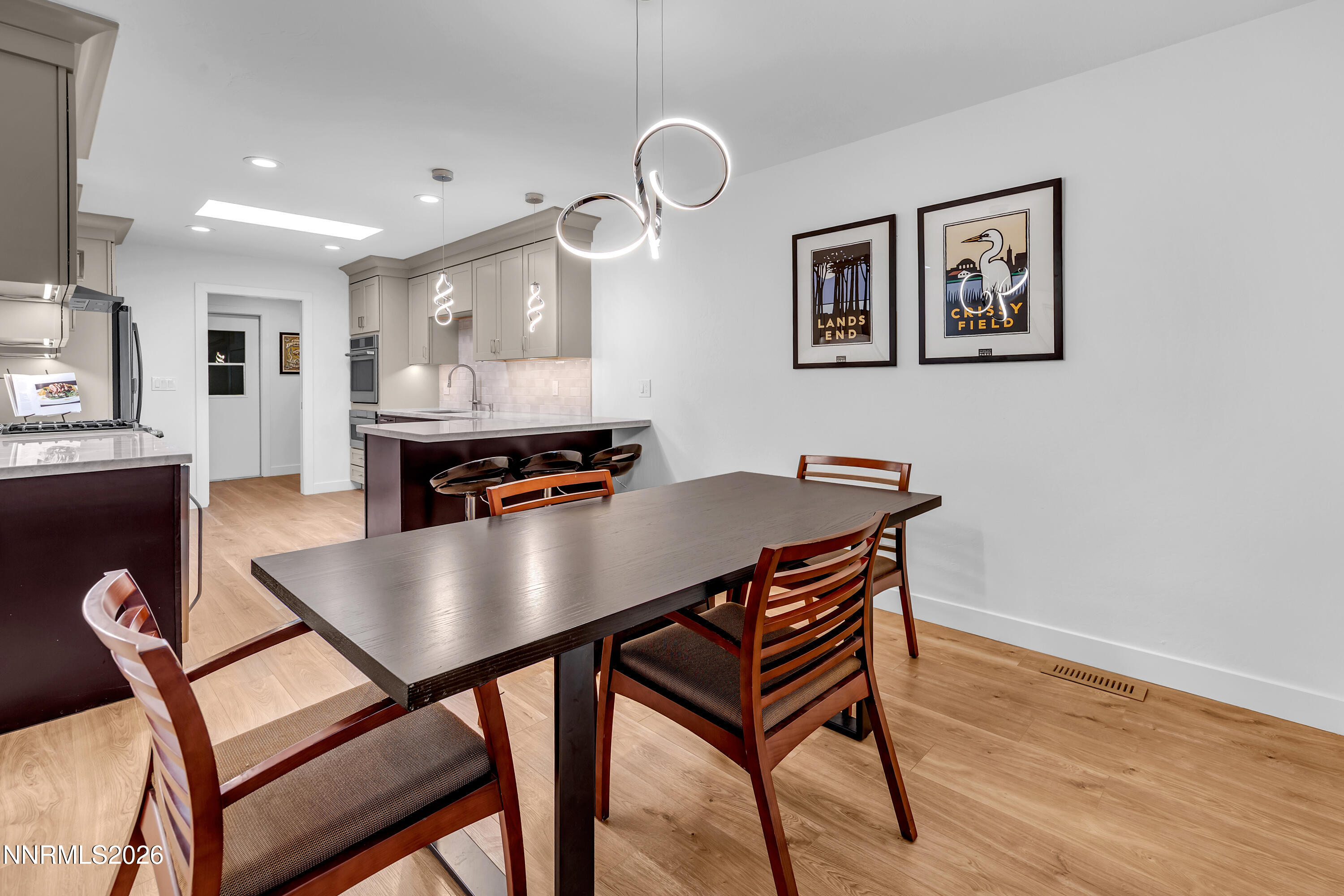 4915 Lakeridge Terrace West Reno, NV 89509 - Photo 7 of 41 a view of a dining room with furniture and wooden floor