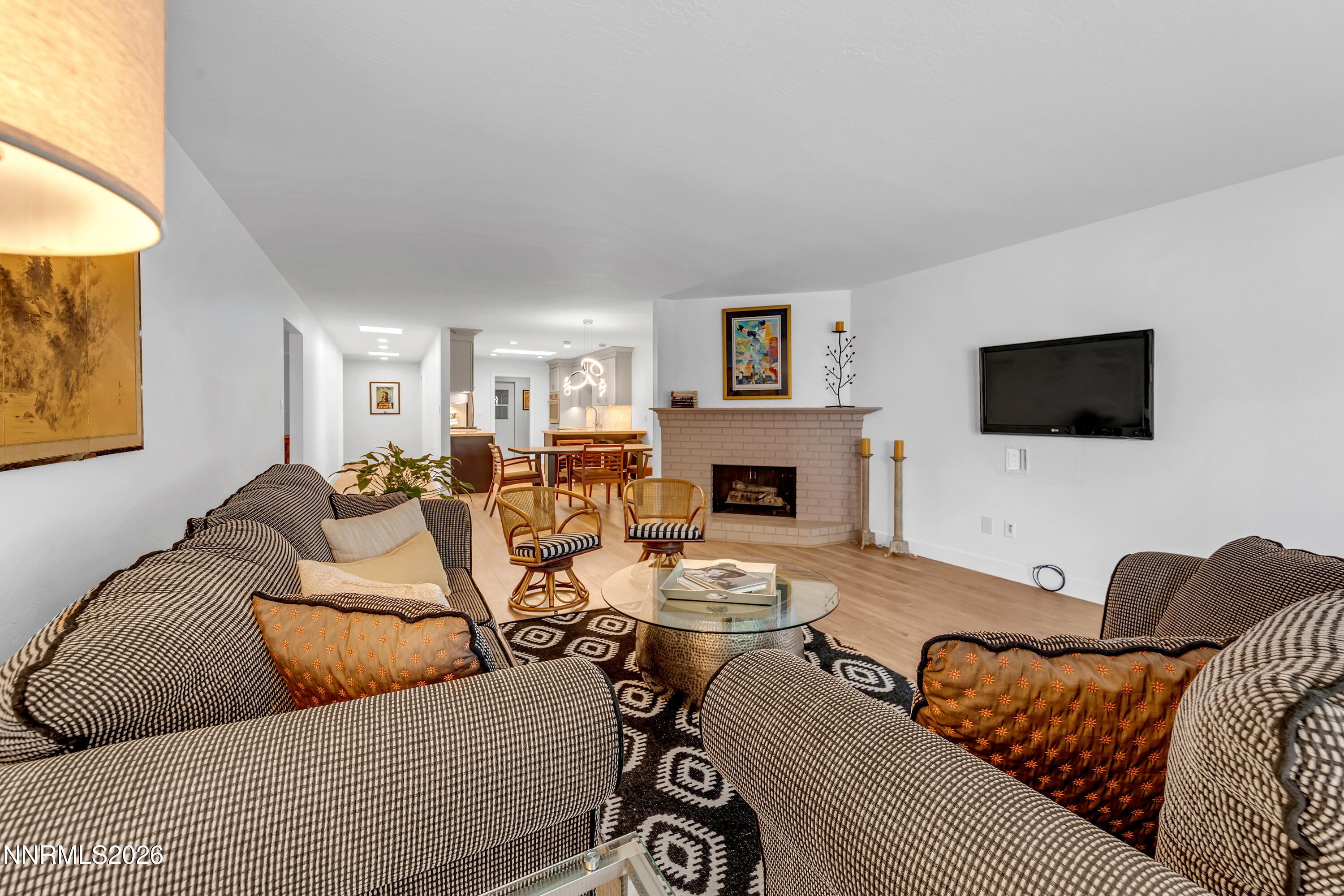 4915 Lakeridge Terrace West Reno, NV 89509 - Photo 10 of 41 a living room with furniture a flat screen tv and a fireplace