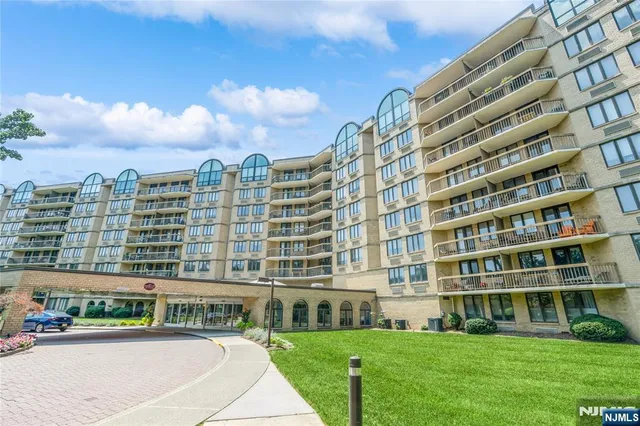 a view of big building with a yard