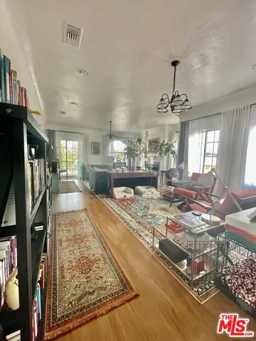 a view of a living room and kitchen