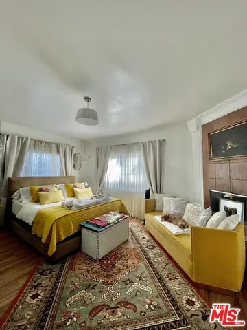 a bed room with bed and window