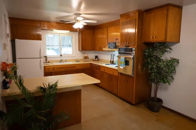 a view of an empty room with a fireplace