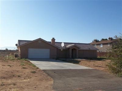 15467 Kiamichi Road Apple Valley, CA 92307 - Photo 1 of 1 a view of a house with a yard
