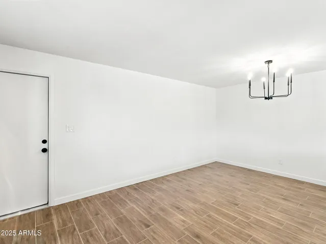 a view of a room with wooden floor and small space