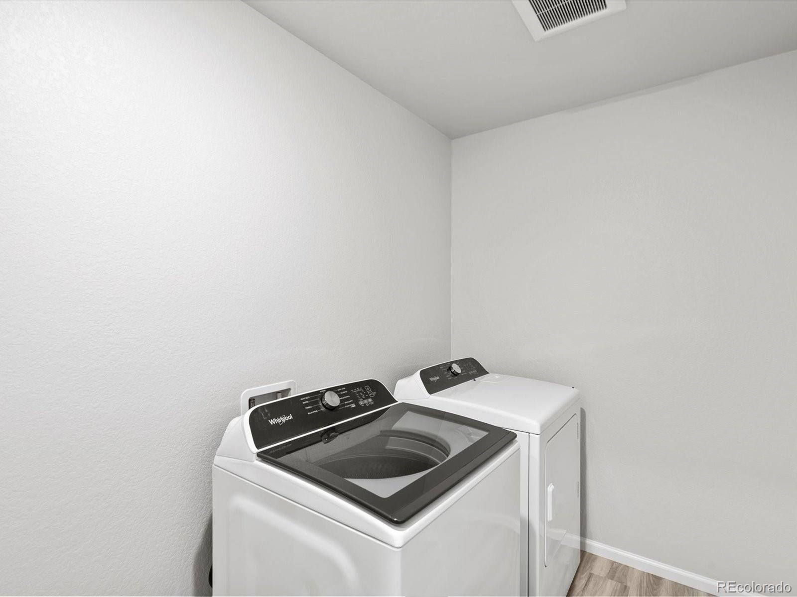 4684 Rabbitbrush Street Johnstown, CO 80534 - Photo 26 of 45 a view of utility room with washer and dryer