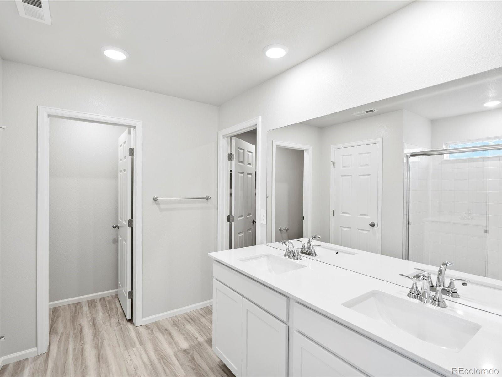 4684 Rabbitbrush Street Johnstown, CO 80534 - Photo 30 of 45 a bathroom with a sink and a mirror