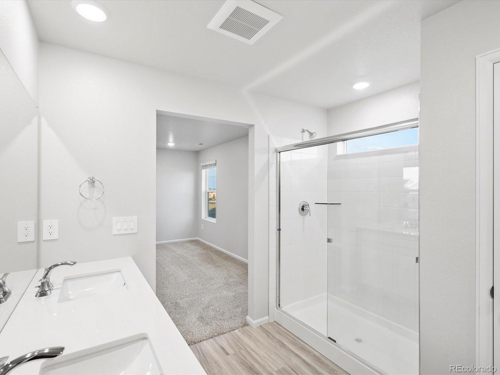 4684 Rabbitbrush Street Johnstown, CO 80534 - Photo 31 of 45 a bathroom with a tub sink and shower