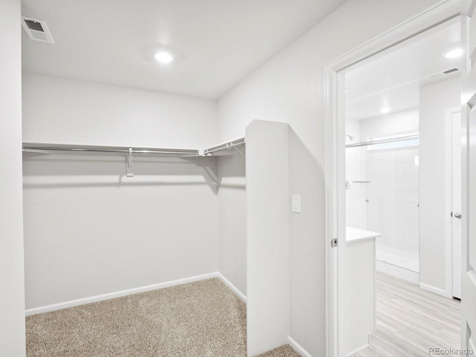 4684 Rabbitbrush Street Johnstown, CO 80534 - Photo 34 of 45 a view of walk in closet with empty racks