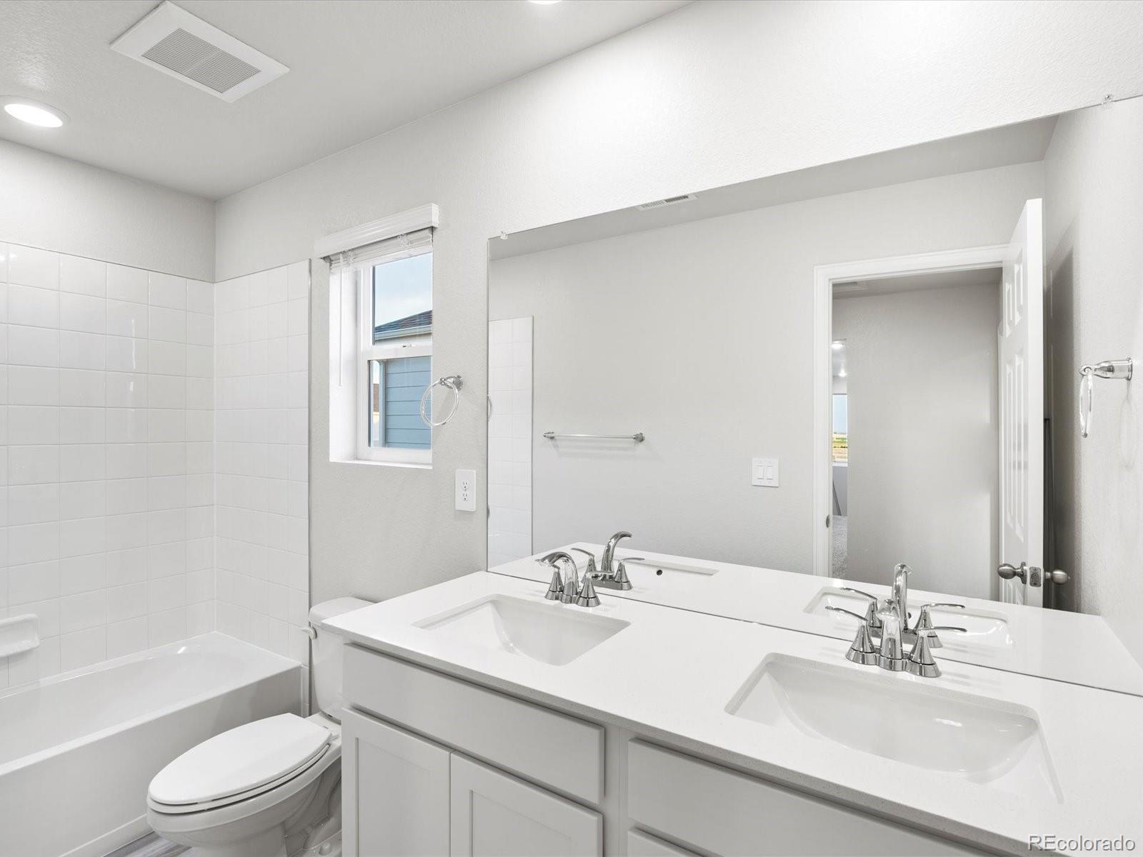 4684 Rabbitbrush Street Johnstown, CO 80534 - Photo 38 of 45 a bathroom with a sink a toilet and shower