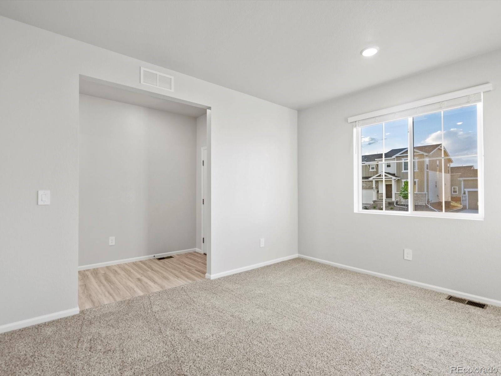 4684 Rabbitbrush Street Johnstown, CO 80534 - Photo 7 of 45 a view of an empty room with a window
