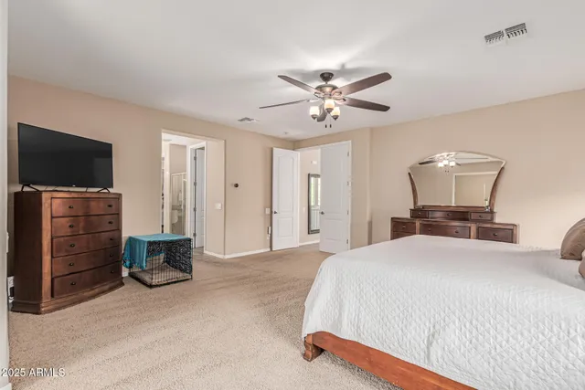 a hallway with a bed and dresser