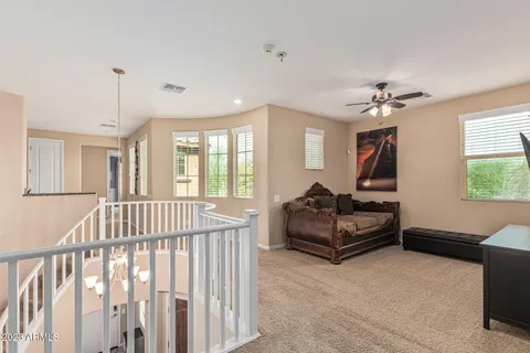 a dining room with furniture window and wooden floor