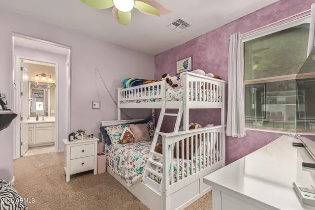 a picture of a room with a table and chairs