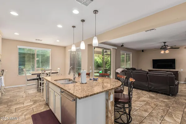 a bedroom with a bed and a television