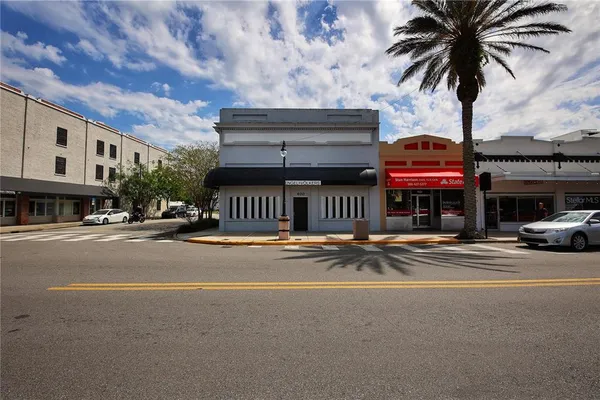 a view of street with parked cars