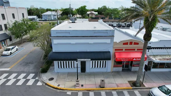 an aerial view of a house with outdoor space