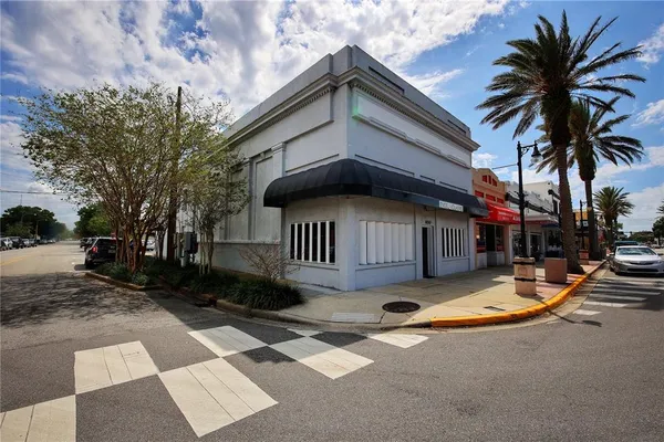 a view of pool with a yard