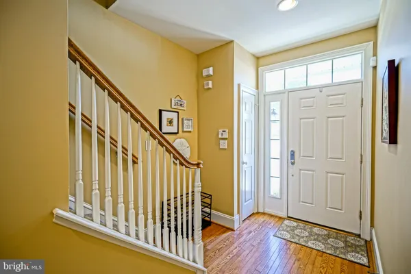 a view of entryway with wooden floor