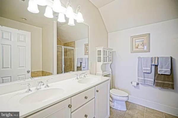 a bathroom with a tub and shower