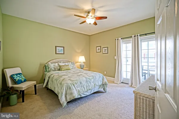 a bedroom with a bed and a table in it