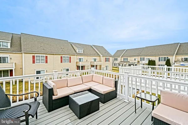 a front view of a house with a yard table and chairs