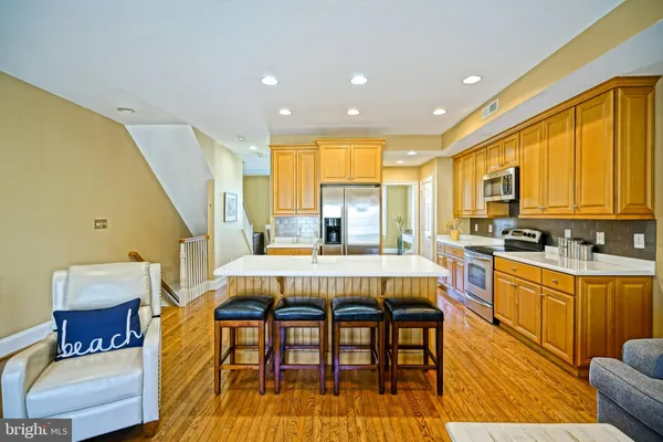 a view of a kitchen with dining table and chairs