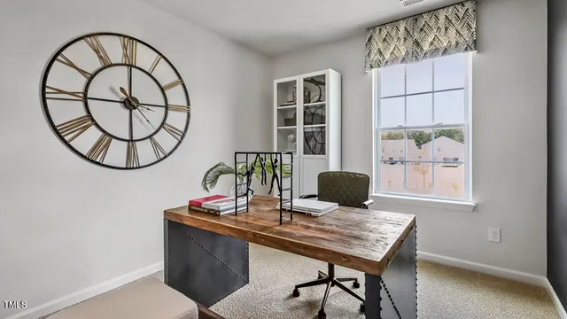 a view of a workspace with furniture