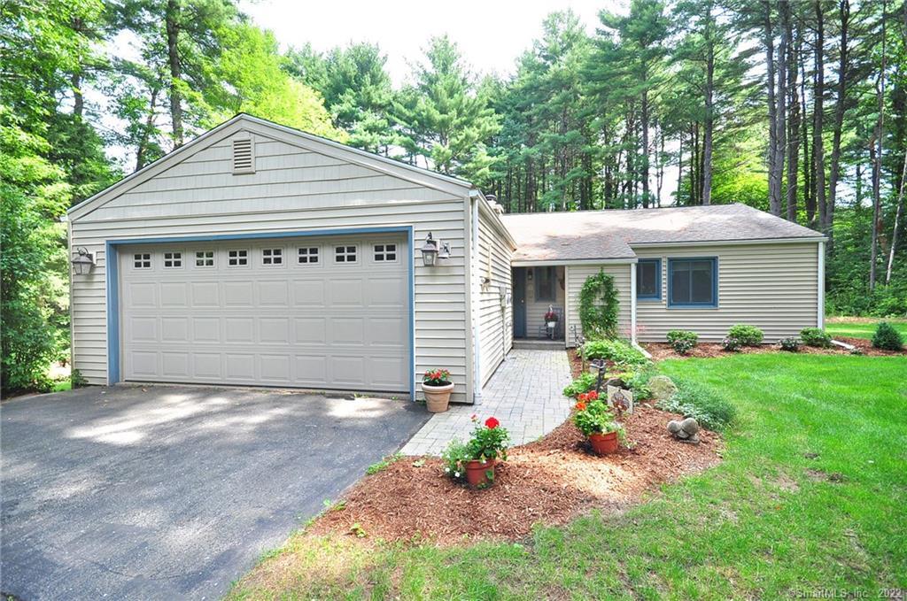 8 Hemlock Road Granby, CT 06035 - Photo 1 of 1 a front view of a house with a yard and garage