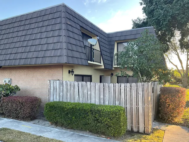 a house view with a garden space