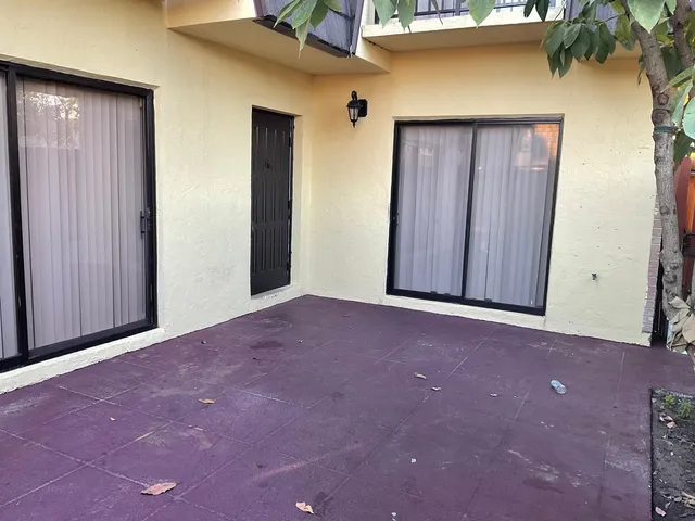 a view of an empty room with a wooden door