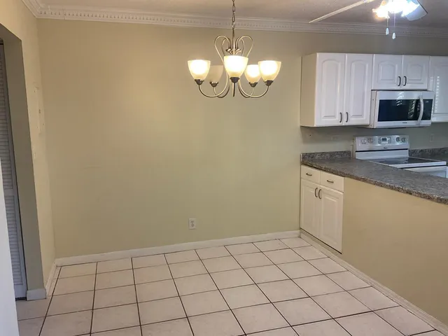 a view of a kitchen with a sink and dishwasher